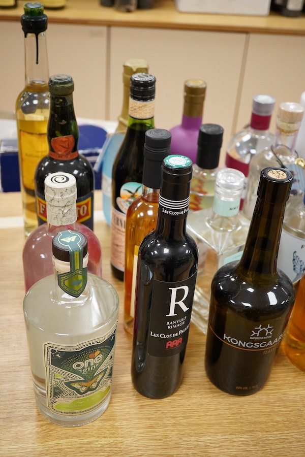A large collection of various spirits and liqueurs, mostly gin, twenty six bottles